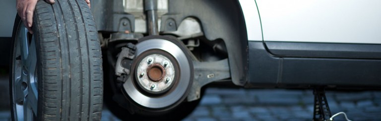 A mechanic changing a wheel